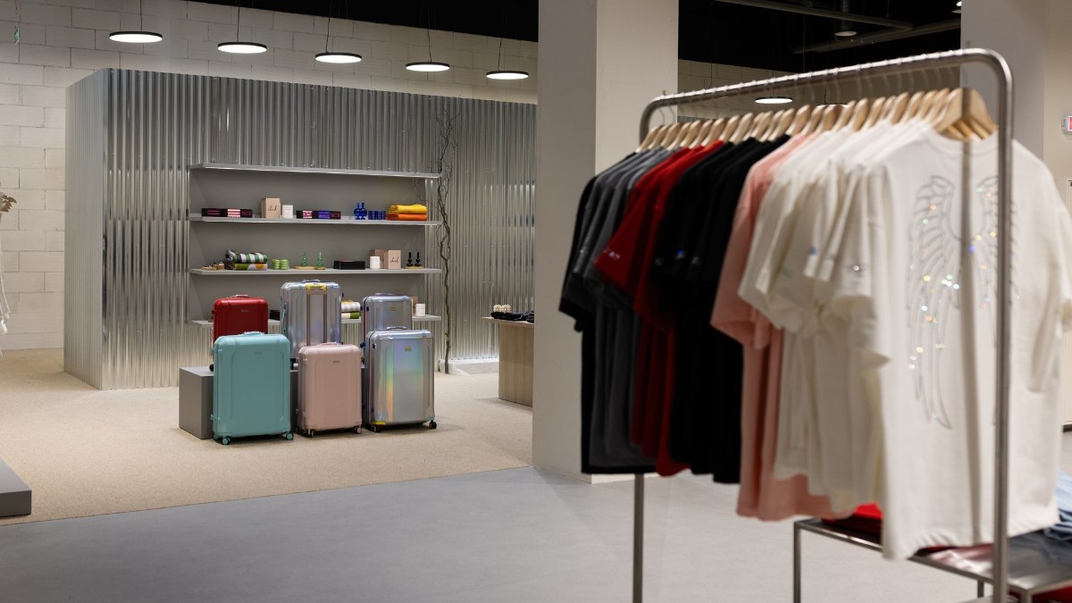 Clothing racks and suitcases at VSI SVOI under track light