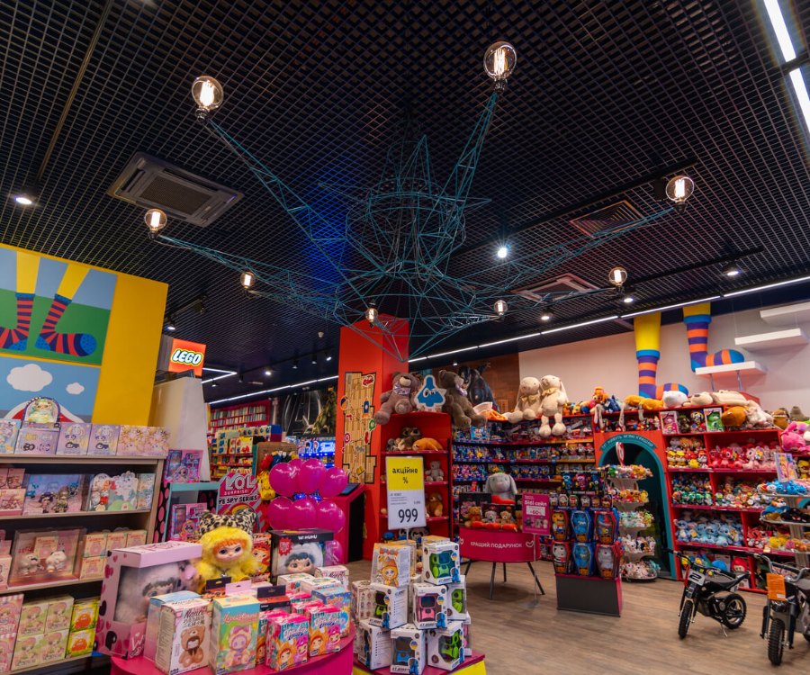 Toy shelving under linear light in Lviv