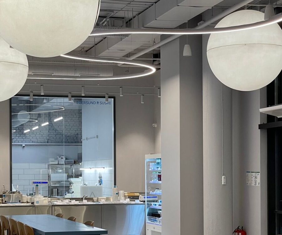 Decorative light spheres above the LAZY KITCHEN café