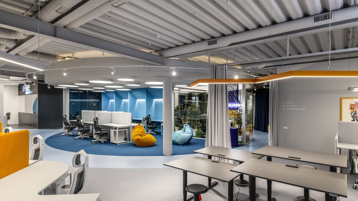 Desks under LINK linear lights at the IONE GAMES office