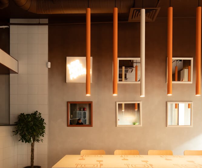 Orange WIRE pendants and SHOOTER-S track spotlights at Not Only Wine