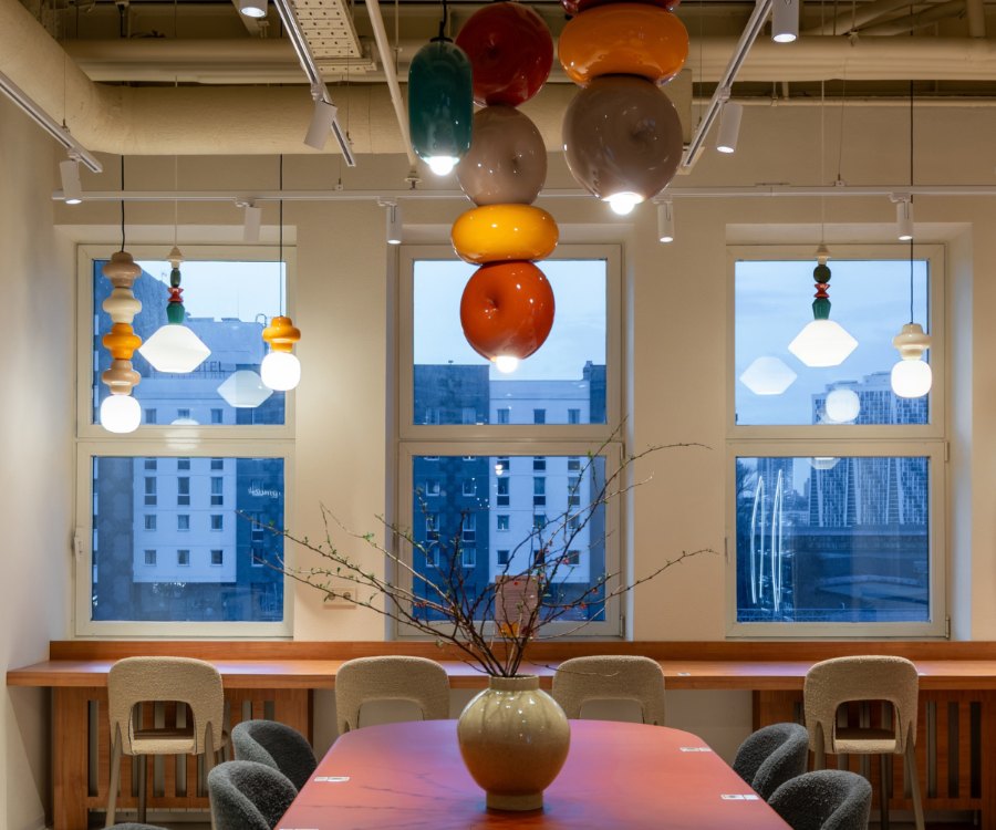 Large table and work counter by the windows at Mastercard Lounge ONE