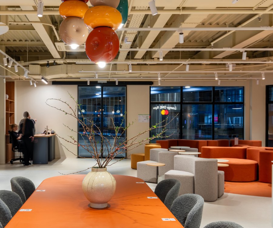 Overall view of the Mastercard Lounge ONE hall with soft seating