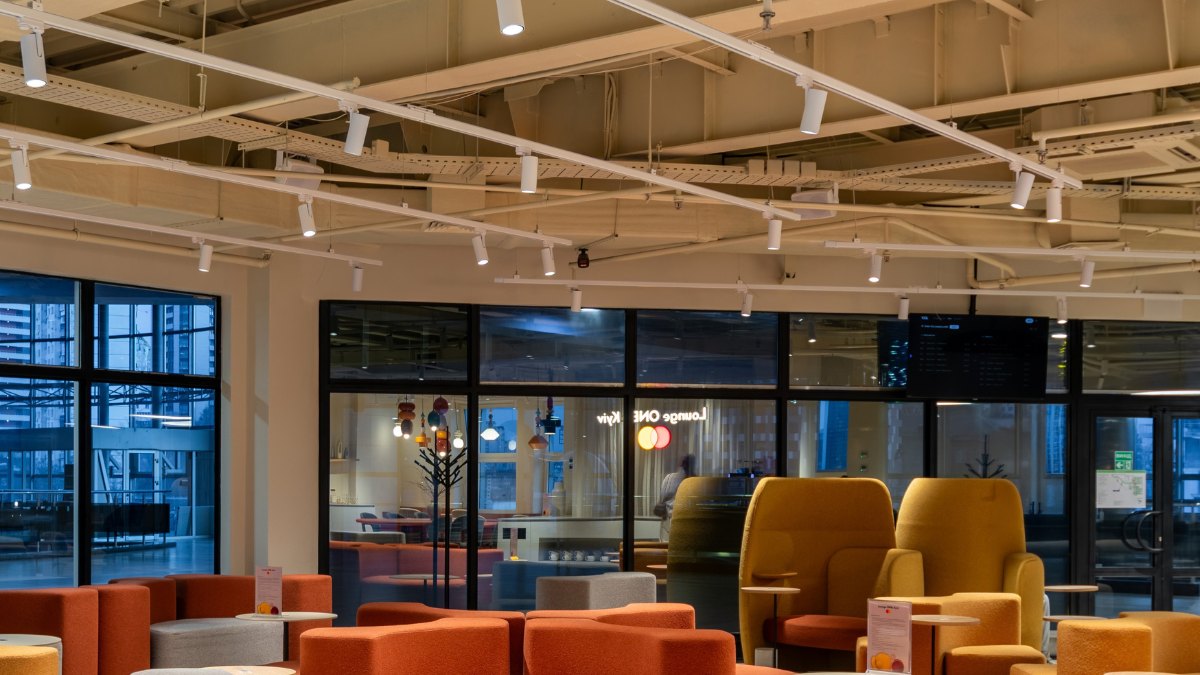 Mastercard Lounge ONE seating area with SHOOTER-S track spotlights under an open ceiling