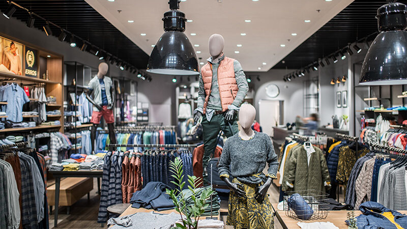 Sales floor of the LERROS shop in Kyiv with mannequins and clothing displays under track luminaires