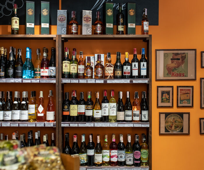 Whisky and wine shelves in the alcohol area of the Cheese Kingdom shop