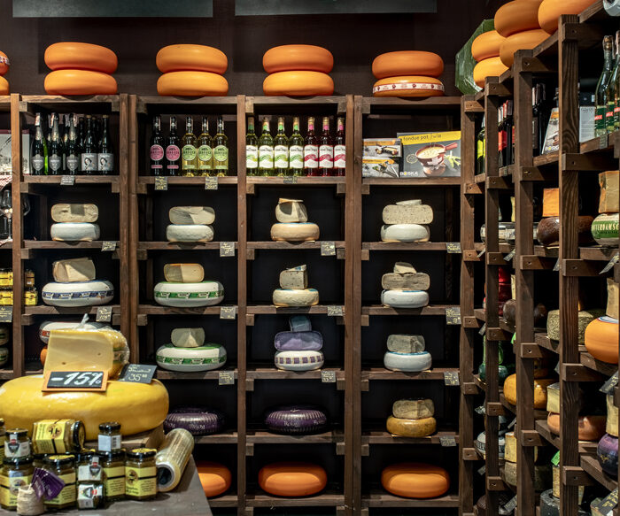 Cheese racks and a tasting table in the Cheese Kingdom shop, Kyiv