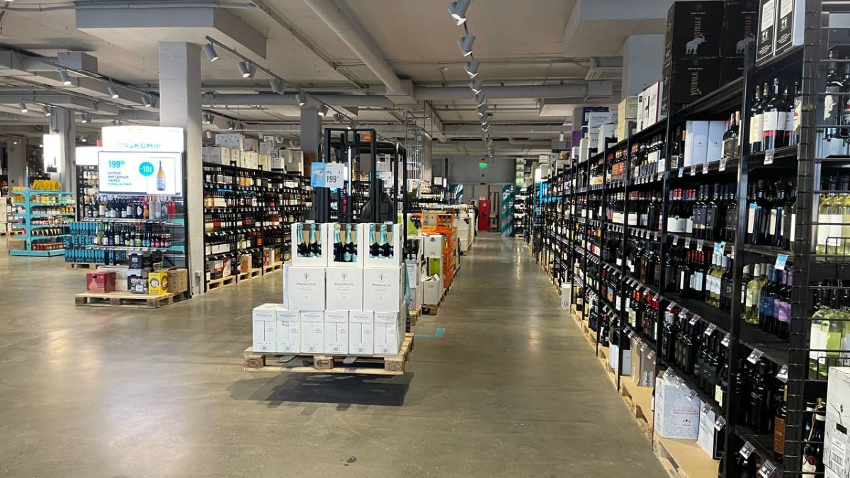 Liquor shelving under SHOOTER-L spotlights at BAD BOY